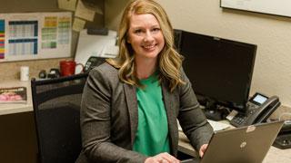 Female businessperson sitting at desk